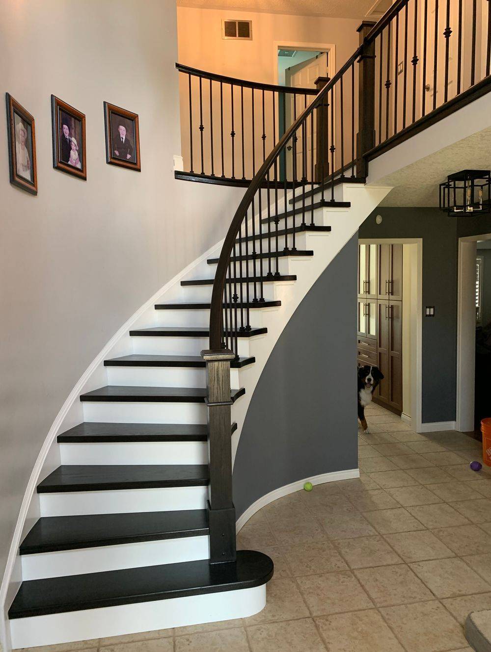 dark grey, black and white rounded staircase