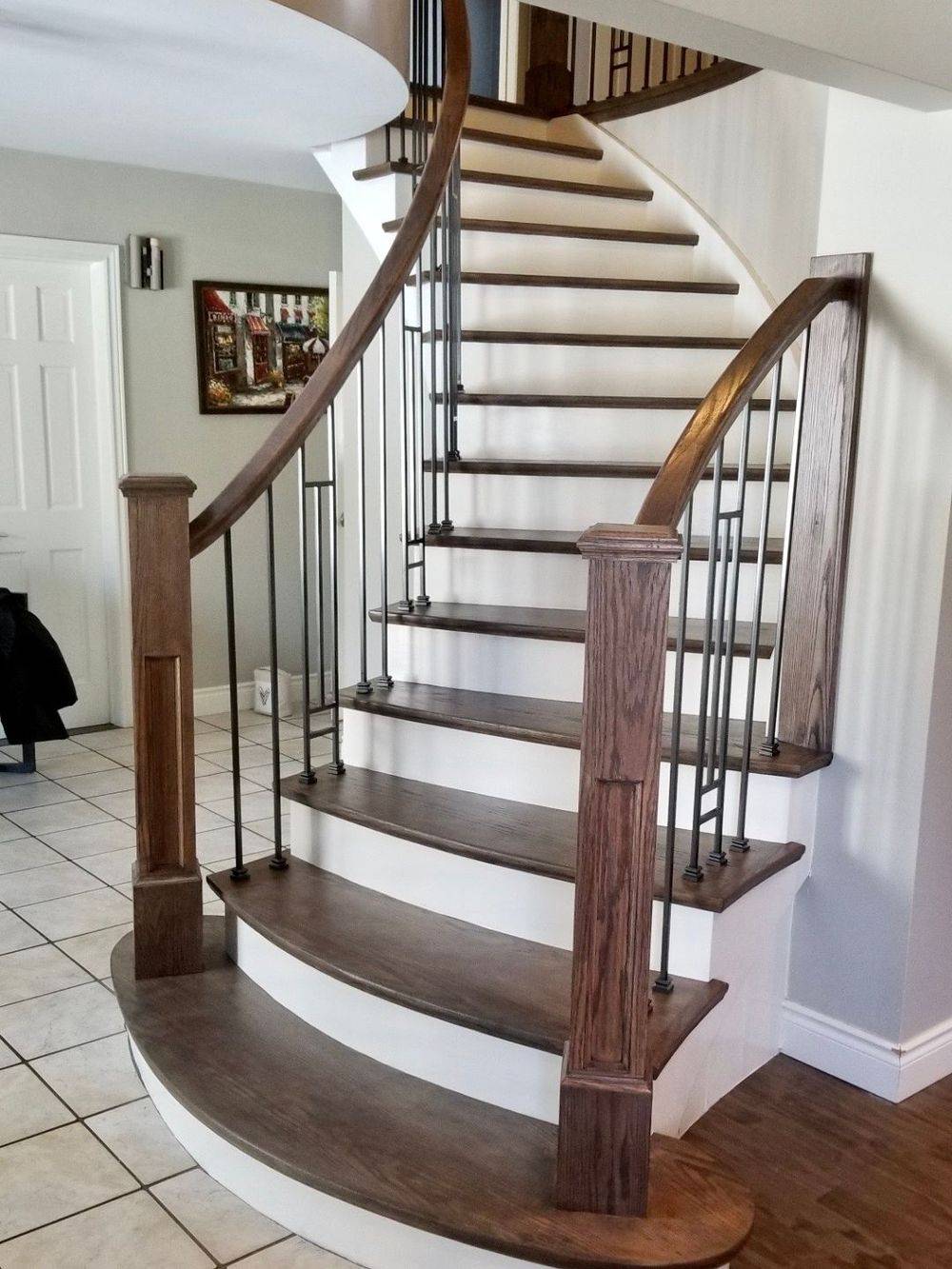 dark stained and white rounded staircase